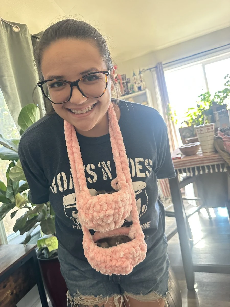 Mercedes wearing pink crochet baskets made for her chicks
